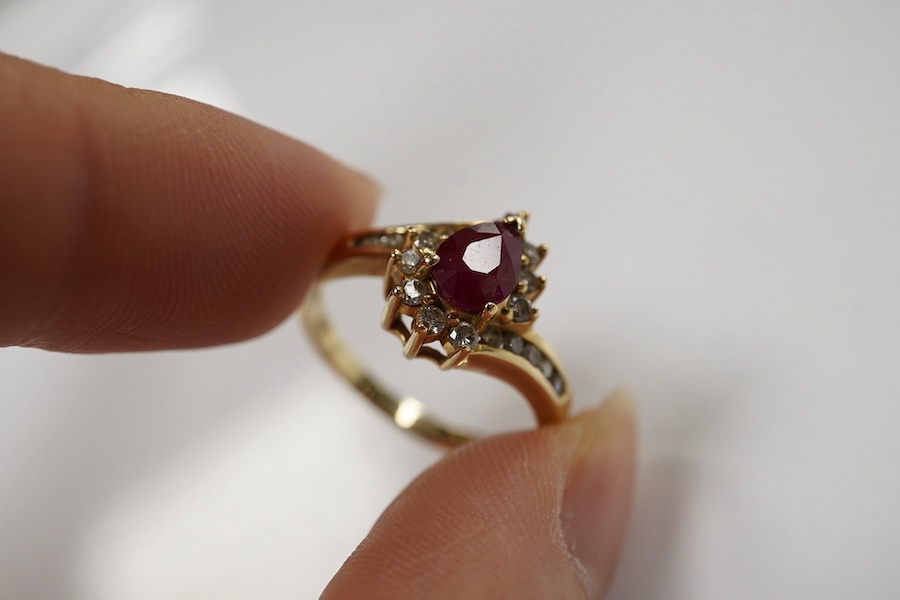 A recent 14k, ruby and diamond cluster set dress ring, size O, gross weight 3.4 grams. Condition - fair to good